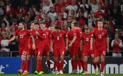 Denmark's forward Andreas Skov Olsen (4th L) celebrates scoring the 2-0 goal with his team-mates during the UEFA Nations League football match between Denmark and France in Copenhagen on September 25, 2022. (Photo by FRANCK FIFE / AFP)