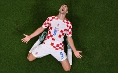 Croatia's forwardAndrej Kramaric celebrates scoring his team's first goal during the Qatar 2022 World Cup Group F match against Canada at the Khalifa International Stadium in Doha on November 27, 2022. (Photo by Antonin THUILLIER / AFP)