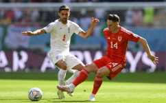 Iran’s Milad Mohammadi, left, and Wales’ Connor Roberts battle for the ball: AFP/Nicolas Tucat