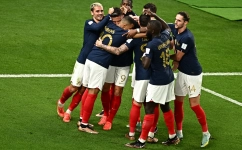 France players celebrate after scoring their fourth goal against Australia at the Al Janoub Stadium on November 22: AFP/Anne-Christine Poujoulat