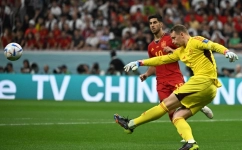 Germany's goalkeeper Manuel Neuer shoots the ball next to Spain's forward Marco Asensio during their Qatar 2022 World Cup Group E match at the Al-Bayt Stadium in Al Khor on November 27, 2022. (Photo by Ina Fassbender / AFP)