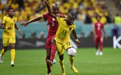 Ecuador's forward #13 Enner Valencia (right) fights for the ball with Qatar's defender #03 Karim Hassan Abdel during their match at the Al-Bayt Stadium on November 20, 2022. (Photo by MANAN VATSYAYANA / AFP)
