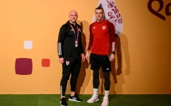 Wales' coach Rob Page and forward Gareth Bale pose for pictures as they arrive for a press conference at the Qatar National Convention Center (QNCC) in Doha on November 24, 2022. (Photo by Nicolas TUCAT / AFP)