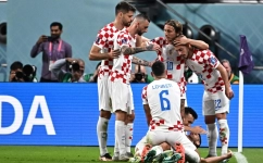 Croatia's players celebrate after Andrej Kramaric scored their team's third goal during the Qatar 2022 World Cup Group F match against Canada at the Khalifa International Stadium in Doha on November 27, 2022. (Photo by Anne-Christine POUJOULAT / AFP)