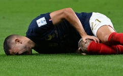 Lucas Hernandez reacts after he sustained an injury during the match against Australia: AFP/Chandan Khanna