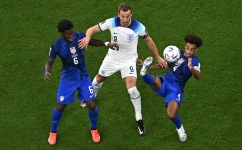 USA’s Yunus Musah, left, Tyler Adams fight for the ball with England’s Harry Kane: AFP/Manan Vatsyayana