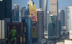 A banner depicting Wales’ captain Gareth Bale (C) hangs alongside a building in Doha on October 23, 2022, ahead of the Qatar 2022 FIFA World Cup football tournament. (Photo by Gabriel BOUYS / AFP).