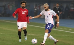 Egypt's forward Mohamed Salah (L) and Belgium's midfielder Yannick Carrasco vie for the ball during the friendly football match between Belgium and Egypt at the Jaber Al-Ahmad Stadium in Kuwait City on November 18, 2022. (Photo by Yasser Al-Zayyat / AFP)