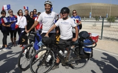 Gabriel Martin, right, and Mehdi Balamissa pose for pictures upon their arrival in Doha: AFP/Jack Guez
