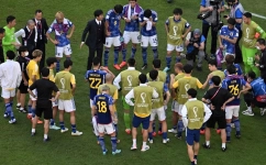 Japan players look dejected after they lost the Qatar 2022 World Cup Group E match against Costa Rica at the Ahmad Bin Ali Stadium in Al-Rayyan on November 27, 2022. (Photo by François-Xavier MARIT / AFP)
