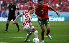 Croatia's Luka Modric and Morocco's Azzedine Ounahi fight for the ball during the World Cup Group F football match at the Al-Bayt Stadium in Al Khor on November 23, 2022. (Photo by OZAN KOSE / AFP)