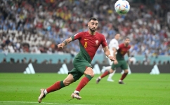 Portugal's midfielder Bruno Fernandes runs for the ball during the Qatar 2022 World Cup Group H match against Uruguay at the Lusail Stadium in Lusail on November 28, 2022. (Photo by PATRICIA DE MELO MOREIRA / AFP)