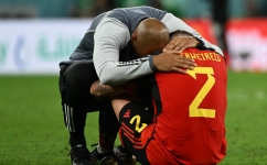 Belgium's assistant coach Thierry Henry hugs defender Toby Alderweireld after the Qatar 2022 World Cup Group F match against Croatia at the Ahmad Bin Ali Stadium in Al-Rayyan on December 1, 2022. (Photo by OZAN KOSE / AFP