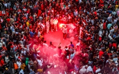 Morocco's supporters celebrate after their country's win of the Qatar 2022 World Cup match against Portugal, in Rabat, on December 10, 2022. (Photo by FADEL SENNA / AFP)