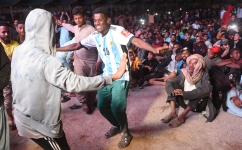 Fans dance as they watch the live broadcast of semifinal between Argentina and Croatia in the Lyari neighbourhood of Karachi: AFP/Rizwan Tabassum