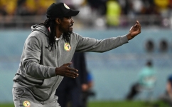 Senegal's coach Aliou Cisse shouts instructions to his players from the touchline during the Qatar 2022 World Cup Group A match against Ecuador at the Khalifa International Stadium in Doha on November 29, 2022. (Photo by OZAN KOSE / AFP)