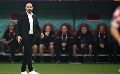 Morocco's coach Walid Regragui watches from the touch line during the Qatar 2022 World Cup third place play-off match against Croatia at Khalifa International Stadium in Doha on December 17, 2022. (Photo by Paul ELLIS / AFP)