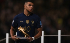 France’s Kylian Mbappe holds the FIFA Golden Boot award: AFP/Adrian Dennis
