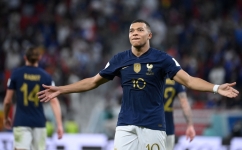 France's Kylian Mbappe celebrates scoring his team's third goal during the Qatar 2022 World Cup round of 16 match against Poland at the Al-Thumama Stadium in Doha on December 4, 2022. (Photo by FRANCK FIFE / AFP)