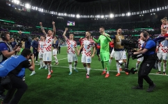 Croatian players celebrate their victory over Brazil: AFP/Jack Guez