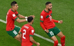 Morocco's forward Youssef En-Nesyri celebrates scoring his team's goal during the Qatar 2022 World Cup quarter-final match against Portugal at the Al-Thumama Stadium in Doha on December 10, 2022. (Photo by NELSON ALMEIDA / AFP)