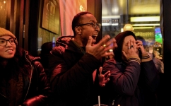Fans react as they watch the third place football match of the Qatar 2022 World Cup between Croatia and Morocco on a screen at 'Le Galant' bar in central Paris on December 17, 2022. (Photo by Martin LELIEVRE / AFP)