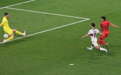 South Korea’s Hwang Hee-Chan scores their winner against Portugal: AFP/Jack Guez