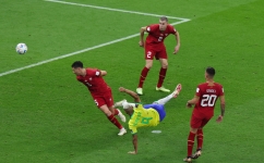 Brazil's forward Richarlison scores his team's second goal during the Qatar 2022 World Cup Group G match against Serbia at the Lusail Stadium in Lusail on November 24, 2022. (Photo by Giuseppe CACACE / AFP)