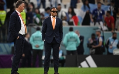 Netherlands' coach Louis Van Gaal and assistant coach Edgar Davids (right) react to their team's defeat in the Qatar 2022 World Cup quarter-final match against Argentina at Lusail Stadium, Qatar, on December 9, 2022. (Photo by Paul ELLIS / AFP)