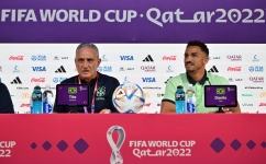 Brazil's coach Tite (left) and defender Danilo give a press conference at the Qatar National Convention Center (QNCC) in Doha on December 8, 2022. (Photo by NELSON ALMEIDA / AFP)