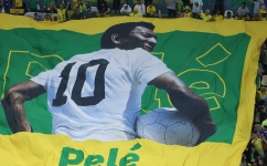 A large flag of Brazil legend Pele is unveiled in the crowd ahead of their group match against Cameroon at the Lusail Stadium on December 2, 2022: AFP/Giuseppe Cacace