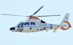 Argentina's Paulo Dybala (left) and Nahuel Molina (right) are seen inside a helicopter as they tour through Buenos Aires' downtown on December 20, 2022. (Photo by Matias BAGLIETTO / AFP)