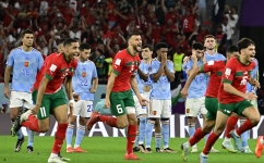 Morocco players celebrate winning the penalty shootout against Spain: AFP/Javier Soriano