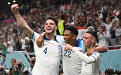 England’s Declan Rice, left, and team-mates Jude Bellingham, centre, and Phil Foden celebrate a goal against Wales: AFP/Ina Fassbender