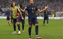 France's forward Kylian Mbappe celebrates scoring his team's second goal during the Qatar 2022 World Cup final match against Argentina at Lusail Stadium in Lusail on December 18, 2022. (Photo by Adrian DENNIS / AFP)