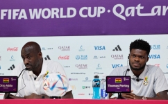 Ghana's coach Otto Addo (left) and midfielder Thomas Partey give a press conference at the Qatar National Convention Center (QNCC) in Doha on December 1, 2022. (Photo by Khaled DESOUKI / AFP)