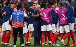 France's coach Didier Deschamps congratulates his players after the Qatar 2022 World Cup semi-final match against Morocco at the Al-Bayt Stadium in Al Khor, north of Doha on December 14, 2022. (Photo by Kirill KUDRYAVTSEV / AFP)