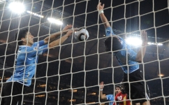 Uruguay’s Luis Suarez, left, stops the ball with his hand leading to a red card and a penalty for Ghana during extra time of their 2010 World Cup quarterfinal: AFP/Roberto Schmidt