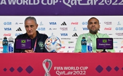 Brazil's coach Tite (left) and Dani Alves give a press conference at the Qatar National Convention Center (QNCC) in Doha on December 1, 2022. (Photo by NELSON ALMEIDA / AFP)