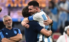 Lionel Messi celebrates with coach Lionel Scaloni  after Argentina won the Qatar 2022 World Cup final match against France at Lusail Stadium in Lusail, north of Doha on December 18, 2022. (Photo by Anne-Christine POUJOULAT / AFP)