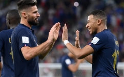 France’s Kylian Mbappe, right, celebrates scoring their second goal with team-mate Olivier Giroud against Poland: AFP/Franck Fife