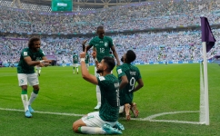 Saudi Arabian players celebrate a goal against Argentina: AFP/Odd Andersen