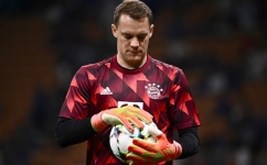 In this file photo taken on September 7, 2022, Bayern Munich's German goalkeeper Manuel Neuer holds a ball ahead of the UEFA Champions League Group C match against Inter Milan in Milan. (Photo by Marco BERTORELLO / AFP)