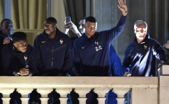 France players and coach Didier Deschamps greet supporters at the Hotel de Crillon, Place de la Concorde, in central Paris: AFP/Julien De Rosa