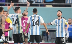 Argentina's forward Lionel Messi (right) celebrate with teammates after they won the Qatar 2022 World Cup round of 16 match against Australia at the Ahmad Bin Ali Stadium in Al-Rayyan on December 3, 2022. (Photo by FRANCK FIFE / AFP)