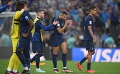 France's Kylian Mbappe and teammates react after losing in the penalty shoot-out of the Qatar 2022 World Cup football final match against Argentina at Lusail Stadium in Lusail on December 18, 2022. (Photo by FRANCK FIFE / AFP)