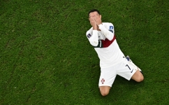 Portugal's Cristiano Ronaldo reacts during the Qatar 2022 World Cup quarter-final match against Morocco at the Al-Thumama Stadium in Doha on December 10, 2022. (Photo by MANAN VATSYAYANA / AFP)