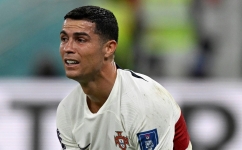 Portugal's forward Cristiano Ronaldo reacts after his team lost the Qatar 2022 World Cup quarter-final match against Morocco at the Al-Thumama Stadium in Doha on December 10, 2022. (Photo by PATRICIA DE MELO MOREIRA / AFP)