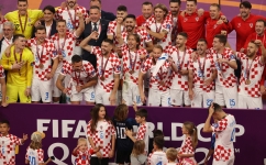 Croatia's players celebrate after winning the Qatar 2022 World Cup football third place play-off match at Khalifa International Stadium in Doha on December 17, 2022. (Photo by ADRIAN DENNIS / AFP)