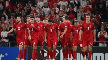 Denmark's forward Andreas Skov Olsen (4th L) celebrates scoring the 2-0 goal with his team-mates during the UEFA Nations League football match between Denmark and France in Copenhagen on September 25, 2022. (Photo by FRANCK FIFE / AFP)